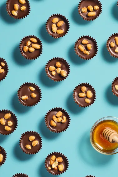 A close up of a chocolate dessert with nuts.