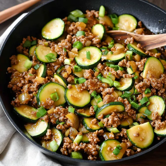 A bowl of food with meat and vegetables.