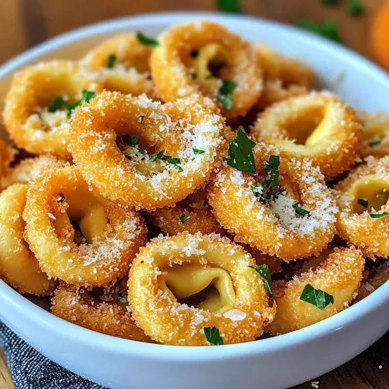 A bowl of pasta with cheese and herbs.
