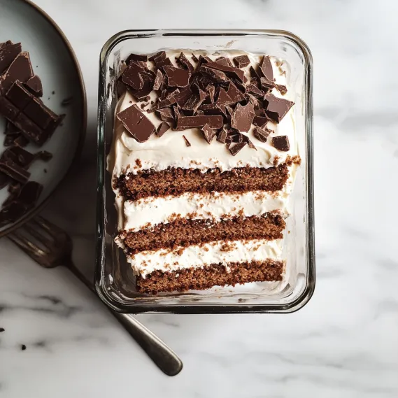 A cake with chocolate and white frosting.