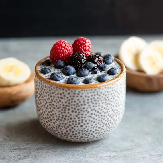 A bowl of berries and bananas.