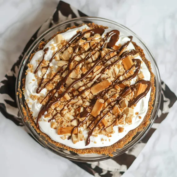A slice of pie with chocolate and nuts.