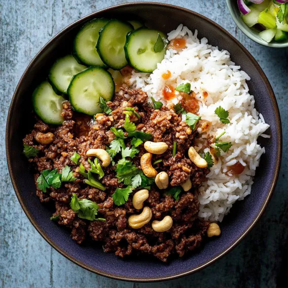 A bowl of food with rice and vegetables.