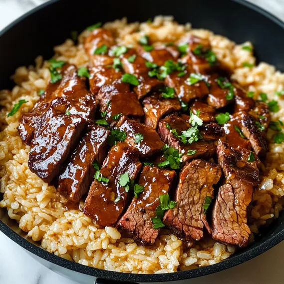 A bowl of rice with meat and vegetables.