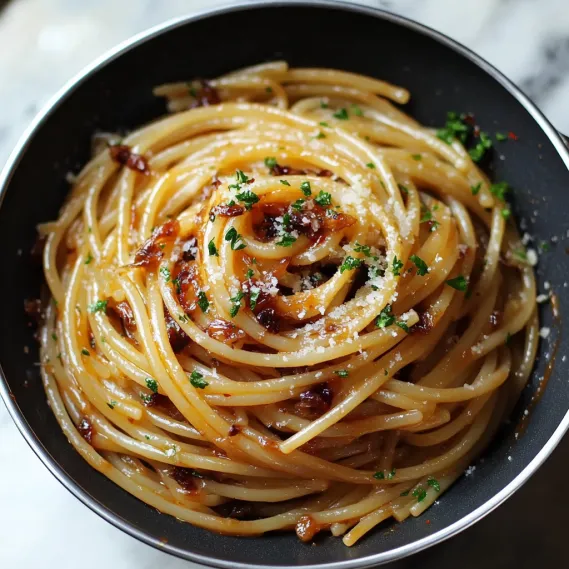 A bowl of spaghetti with meat sauce.