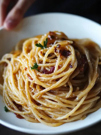 A bowl of spaghetti with meatballs.