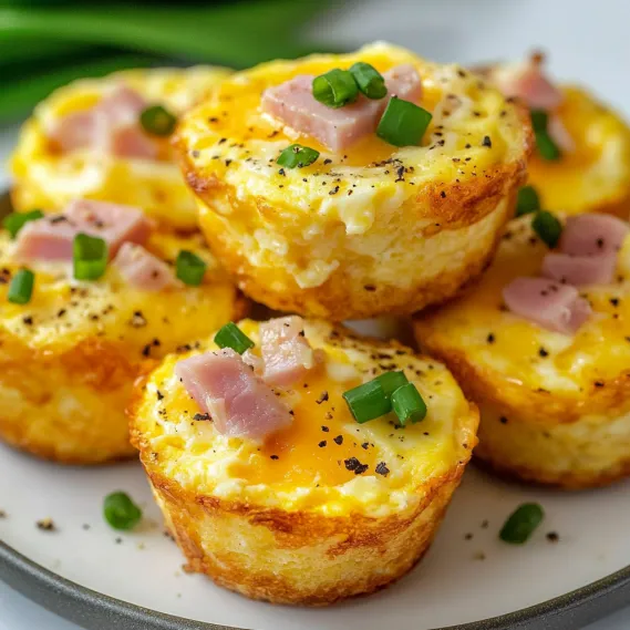 A plate of ham and cheese muffins.