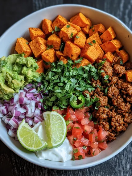 A bowl of food with a variety of ingredients.