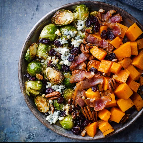 A bowl of food with a variety of ingredients.