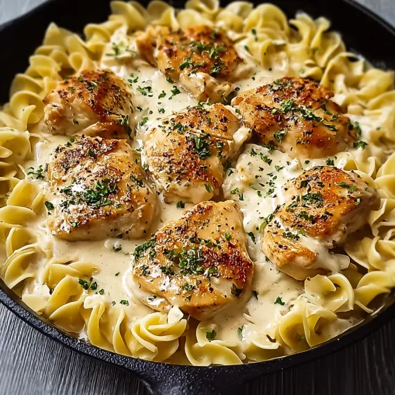A pan of chicken and pasta.