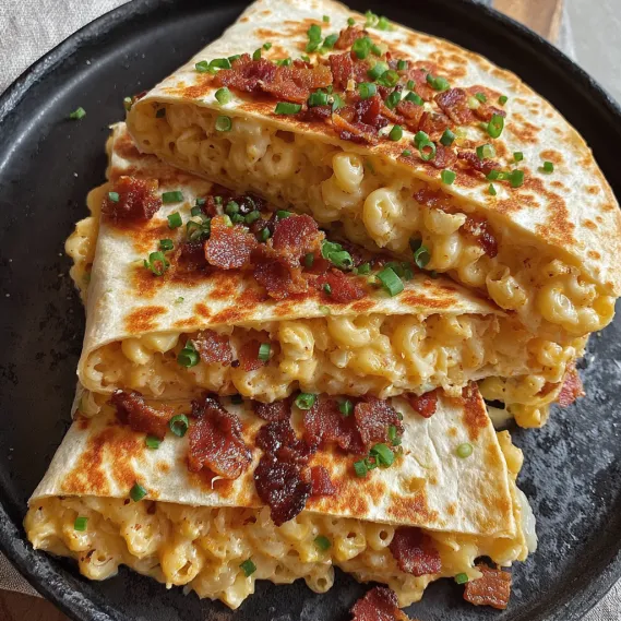 A plate of food with bacon and macaroni.