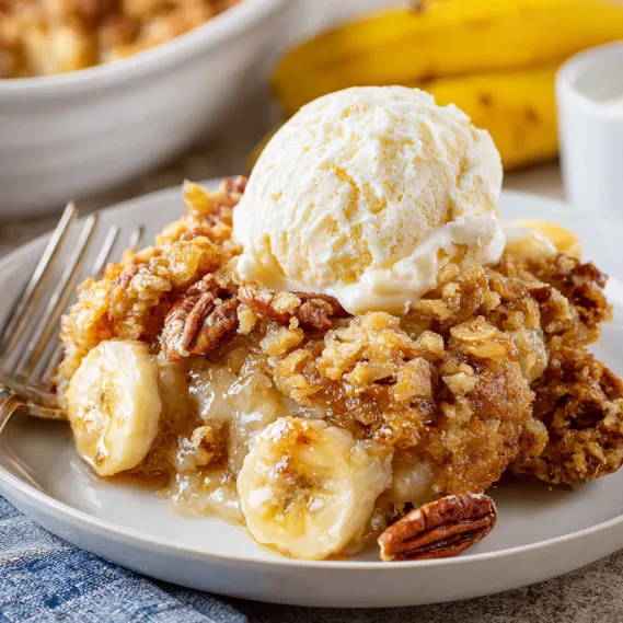 A plate of food with a scoop of ice cream on top.
