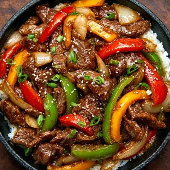 A bowl of beef and vegetables.
