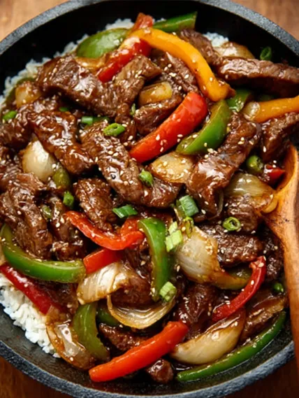 A bowl of beef and vegetables.