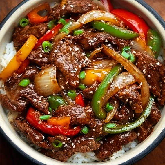 A bowl of beef and vegetables.