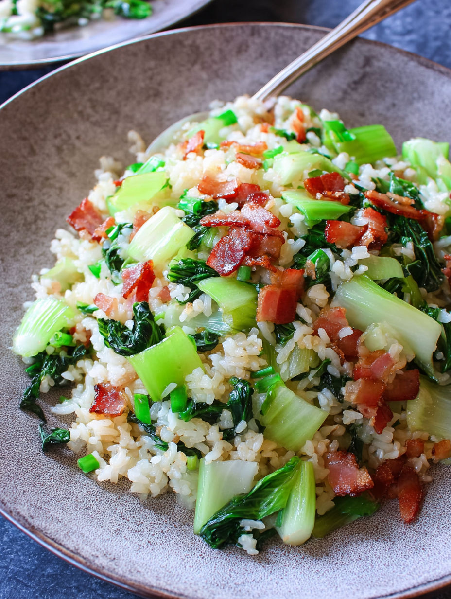 A bowl of rice with bacon and broccoli.