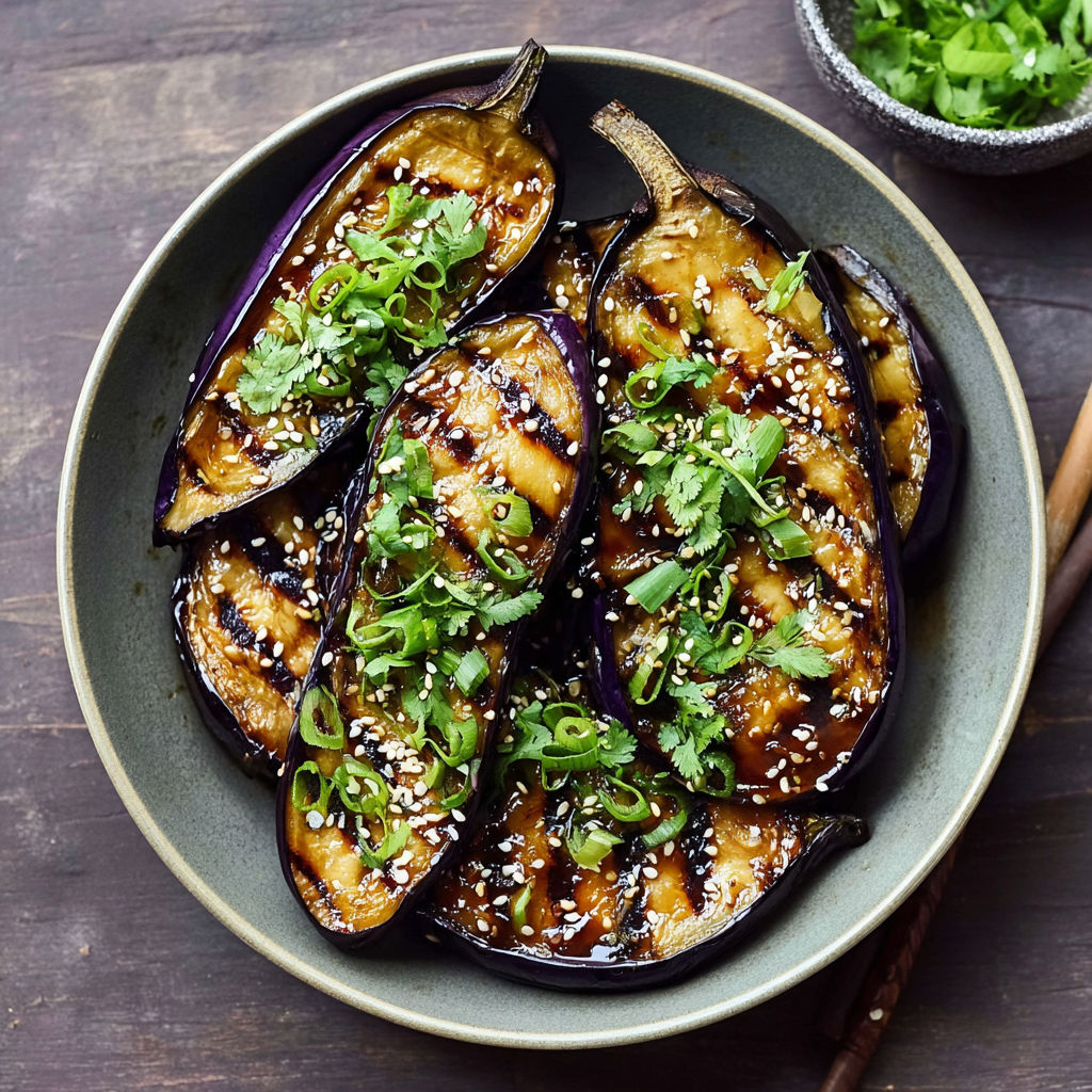 A plate of grilled eggplant with a miso glaze.