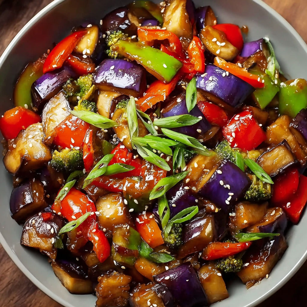 A bowl of stir fry with eggplant, peppers, and broccoli.