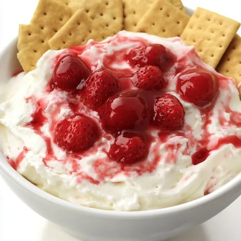 A bowl of strawberry shortcake with crackers.
