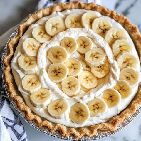 A pie with bananas and cream.