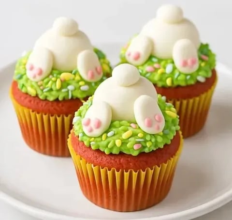Cupcakes with white frosting and pink frosting.