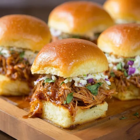 A plate of sandwiches with meat and vegetables.