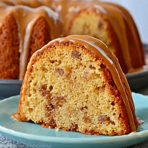 A cake with caramel drizzled on top.