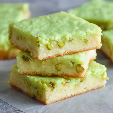 Green cake on a table.