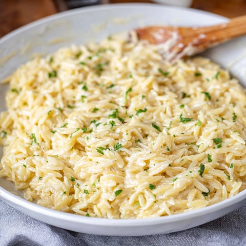A bowl of creamy garlic Parmesan orzo.