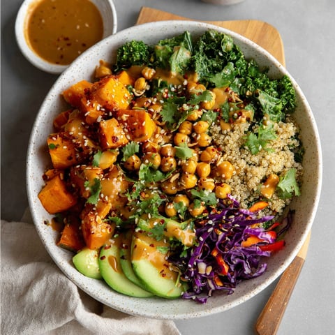 A bowl of Thai Peanut Sweet Potato Buddha Bowl.