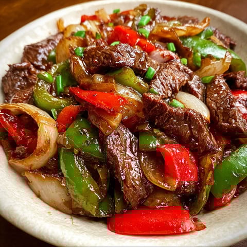 A bowl of beef and vegetables.