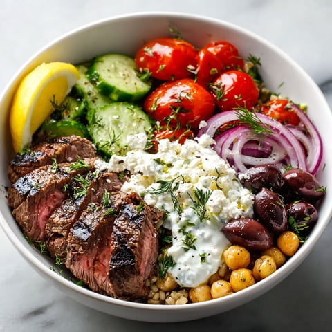 A bowl of food with meat, vegetables, and cheese.