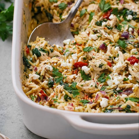 A Greek chicken casserole in a white dish.