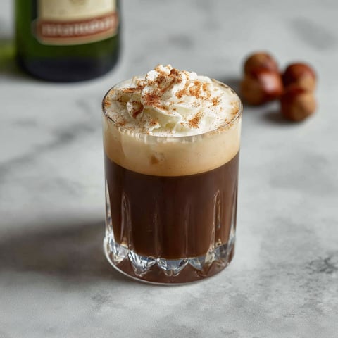 A glass of hazelnut coffee cocktail with Frangelico.