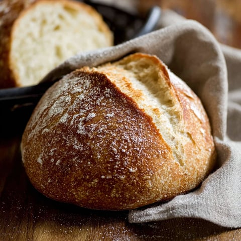 Two loaves of bread on a table.