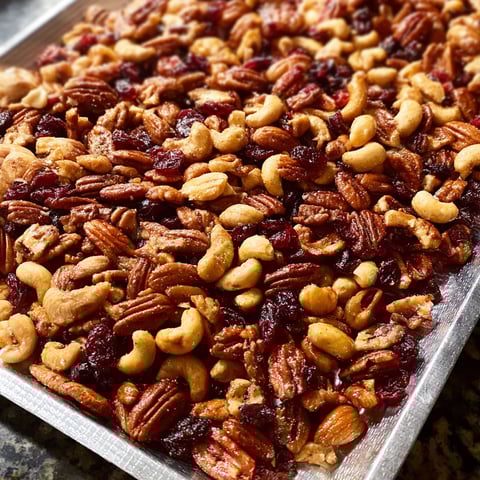 A pan of nuts and dried cherries.