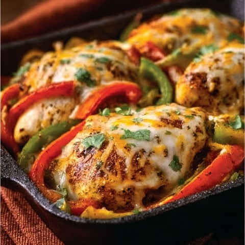 A pan of cheesy baked fajita chicken.